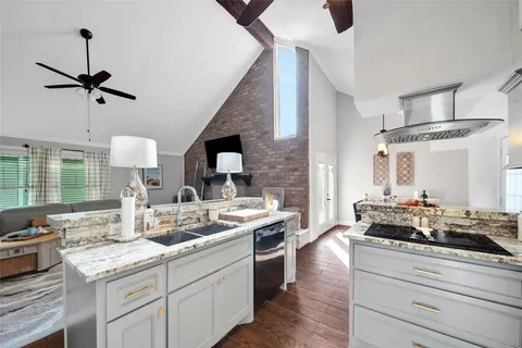 a kitchen with a stove and cabinets