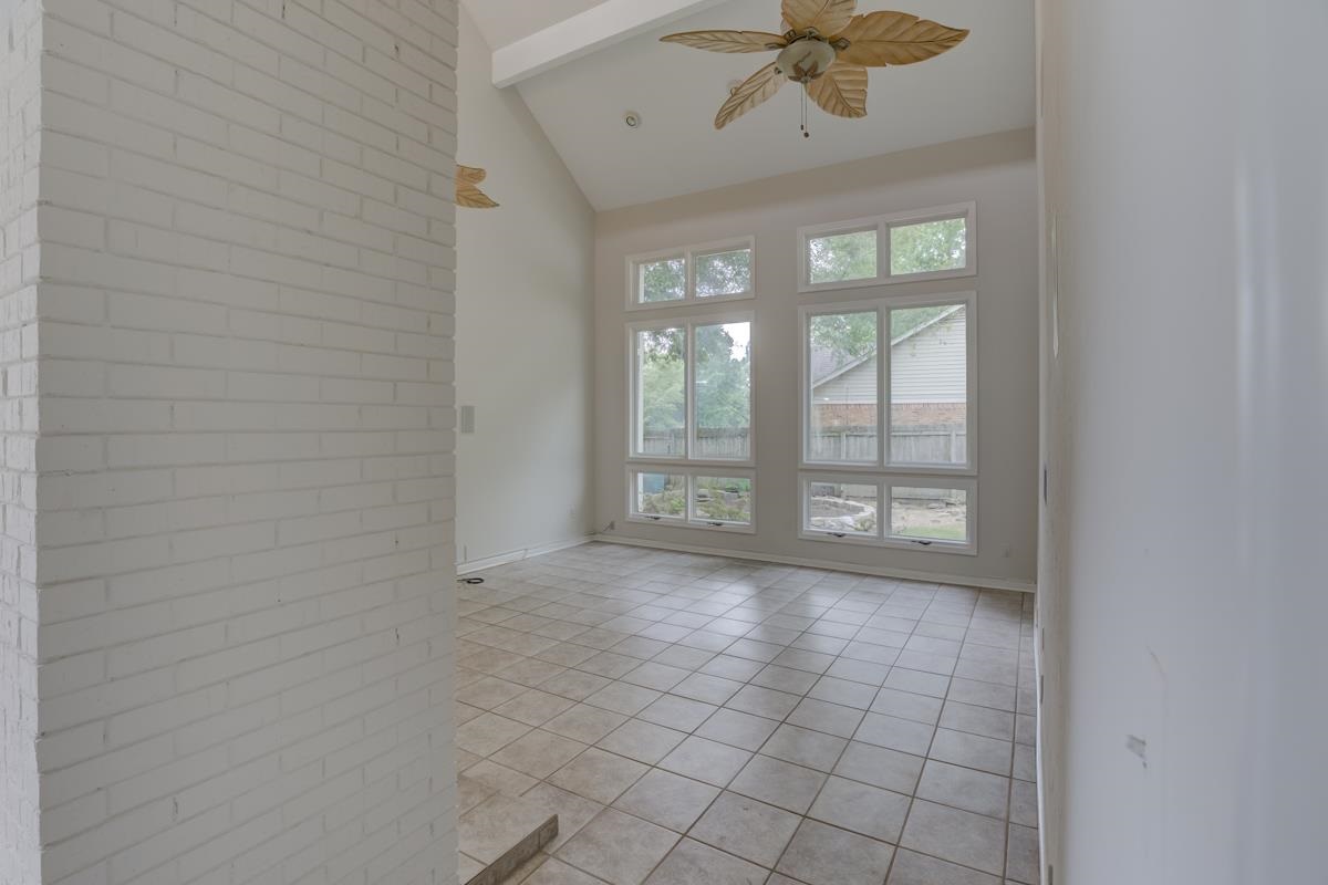 7194 Crestridge Road Memphis, TN 38119 - Photo 13 of 25 Oversized windows and fireplace in this large family room
