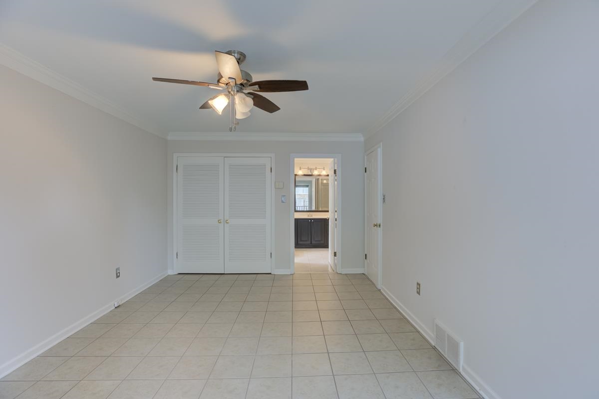 7194 Crestridge Road Memphis, TN 38119 - Photo 15 of 25 Primary bedroom with double closets and private balcony.