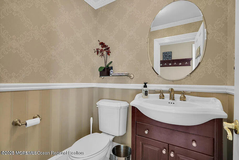 1722 Burrsville Road Brick, NJ 08724 - Photo 18 of 27 a bathroom with a sink vanity mirror and toilet