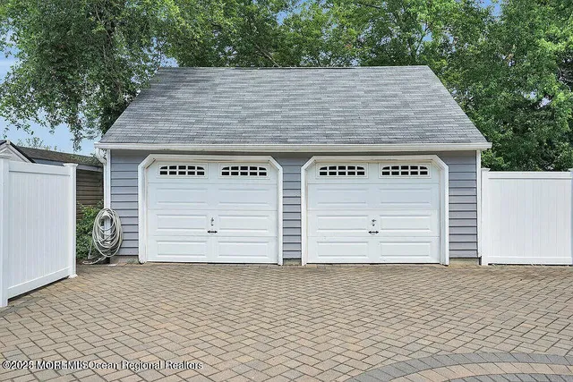an old building with wooden fence