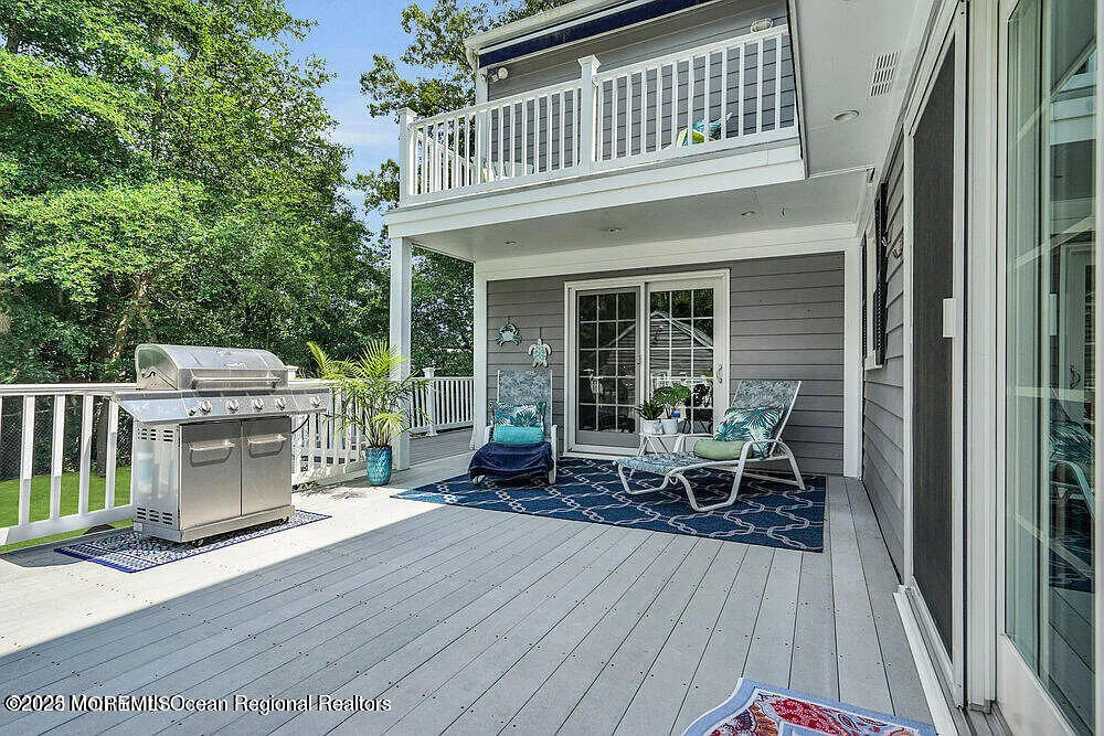 1722 Burrsville Road Brick, NJ 08724 - Photo 6 of 27 a balcony with furniture and wooden floor