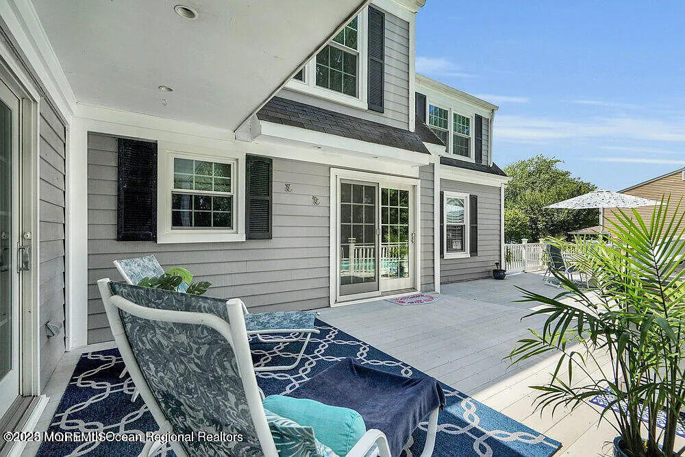 1722 Burrsville Road Brick, NJ 08724 - Photo 7 of 27 a view of a patio with table and chairs and potted plants