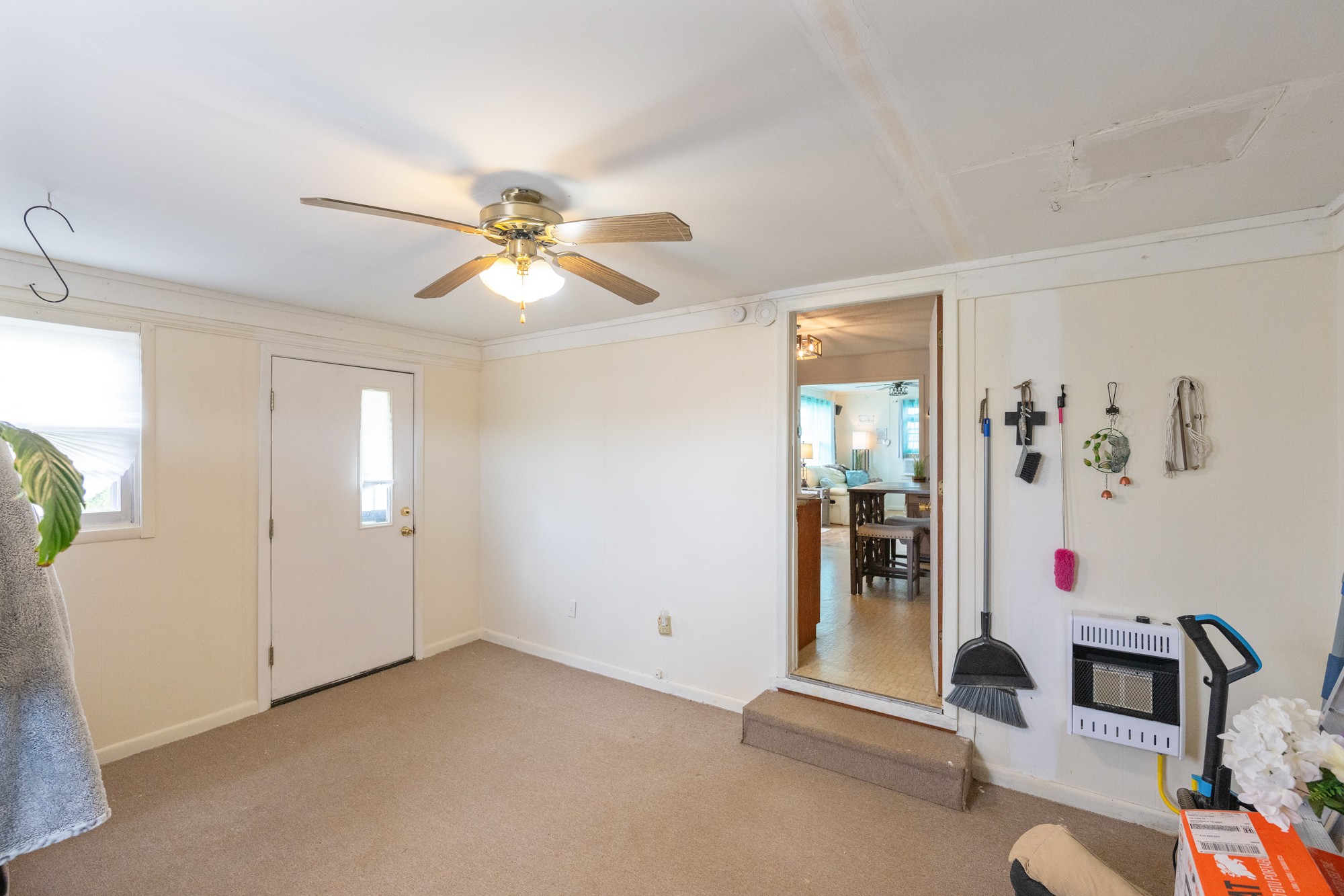 252 Luna Street Decaturville, TN 38329 - Photo 12 of 21 a view of livingroom with furniture and ceiling fan