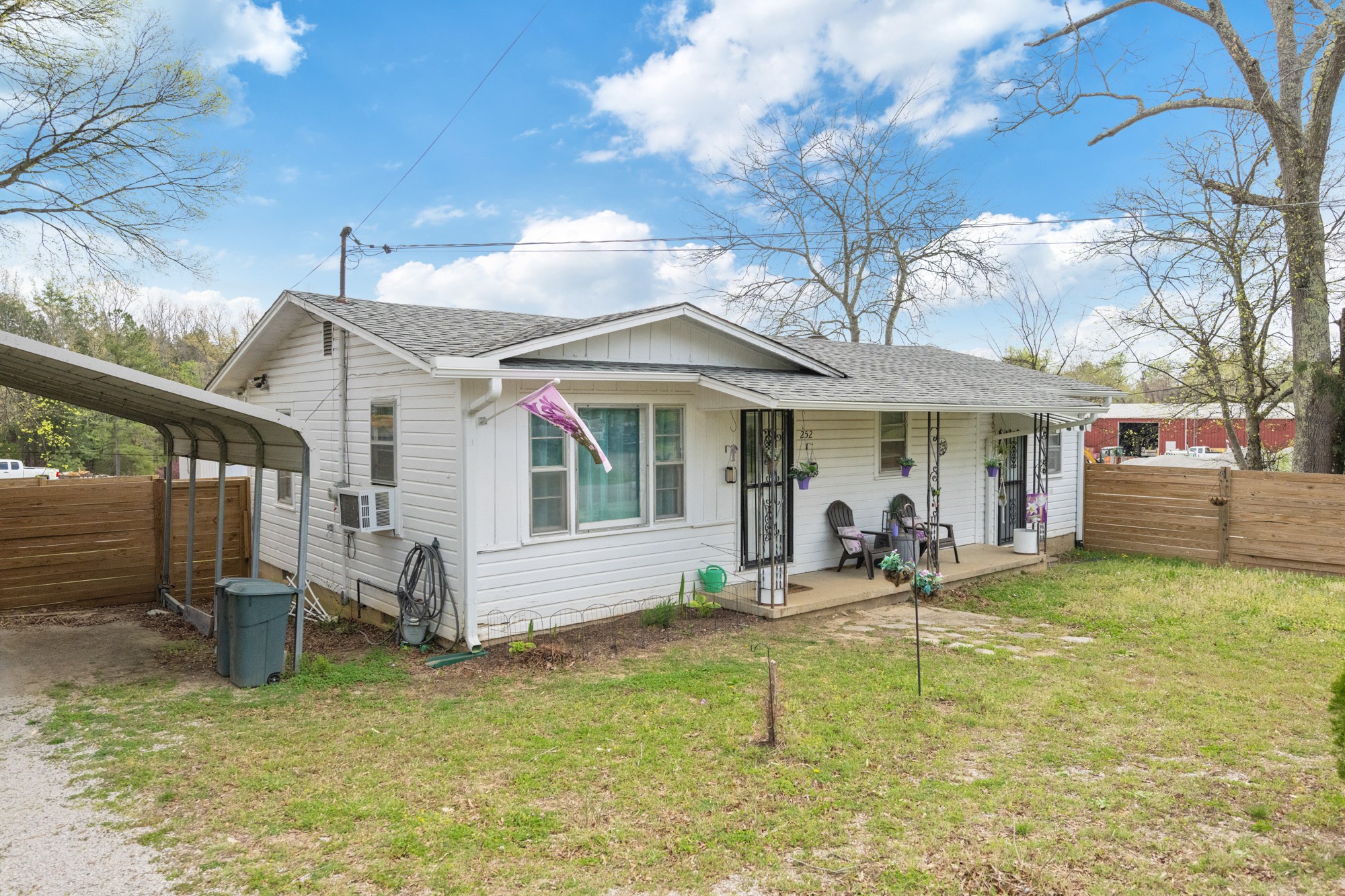 252 Luna Street Decaturville, TN 38329 - Photo 19 of 21 a view of a house with a yard patio and fire pit