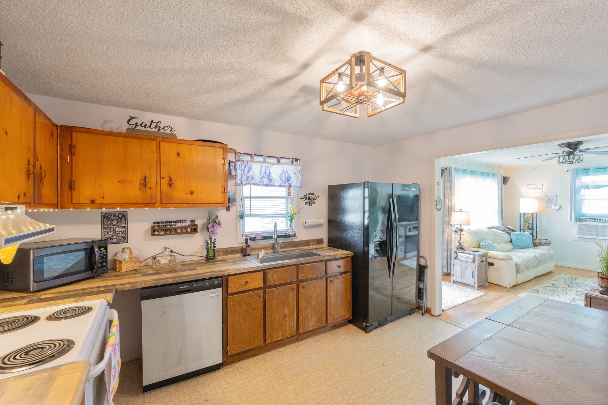 252 Luna Street Decaturville, TN 38329 - Photo 6 of 21 a kitchen with a sink cabinets and stainless steel appliances
