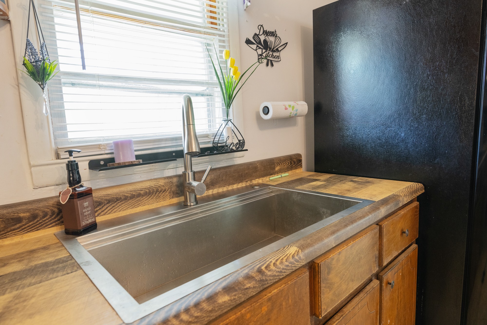 252 Luna Street Decaturville, TN 38329 - Photo 7 of 21 a view of a sink a window and an entryway