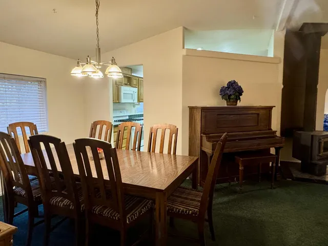 a kitchen with stainless steel appliances a sink and a refrigerator