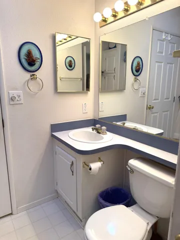 a bathroom with a sink a mirror and bathtub