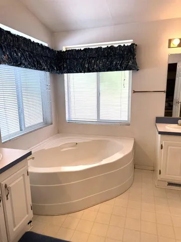 a bedroom with a bed chair and a desk