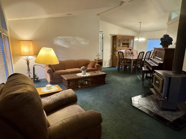 a living room with furniture and a table