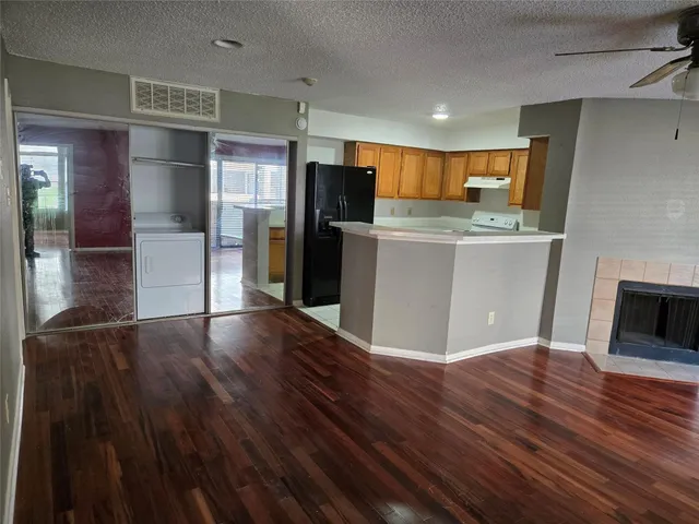a view of kitchen with cabinets and stainless steel appliances