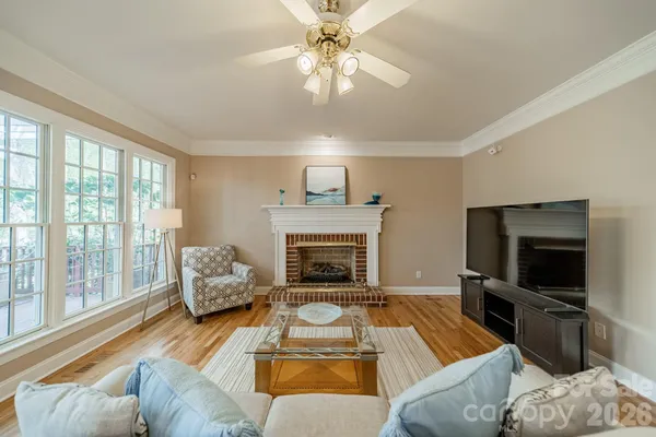 a dining room with furniture and wooden floor