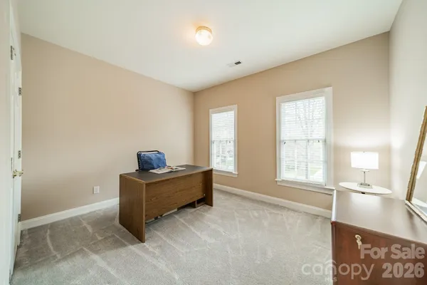 a bedroom with a bed and cabinets