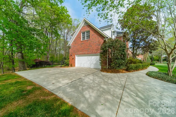 a view of a house with a yard and sitting area