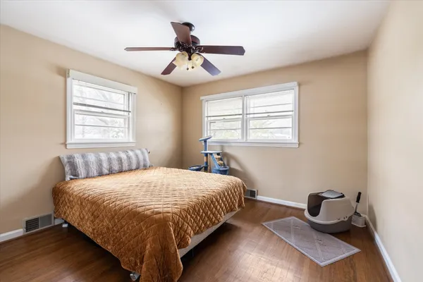 a bedroom with a bed and window