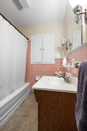a bathroom with a sink and a mirror