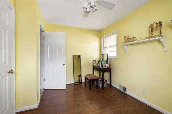 a view of dining room with furniture and wooden floor