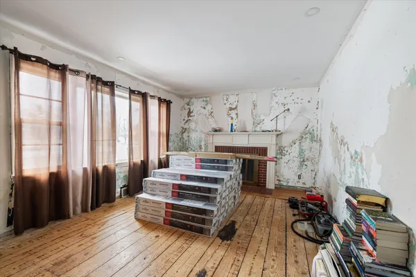 a view of a livingroom with furniture and staircase