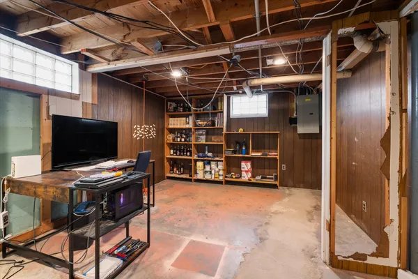 a view of a livingroom with furniture and a flat screen tv