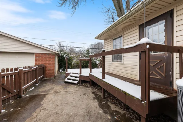 a view of a porch with furniture and a window