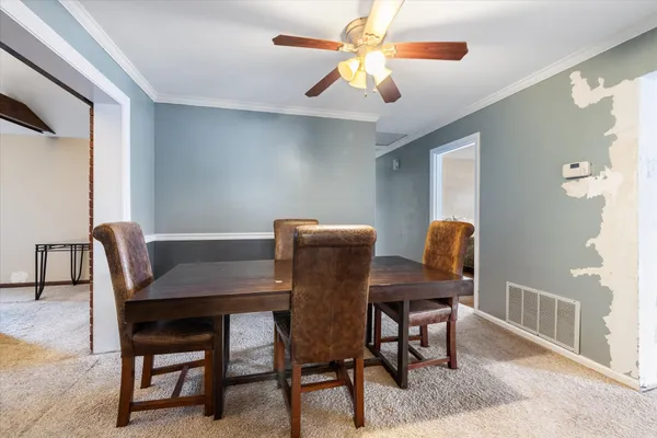 a view of a dining room with furniture