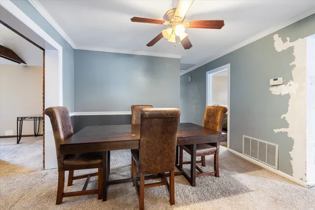 a view of a dining room with furniture