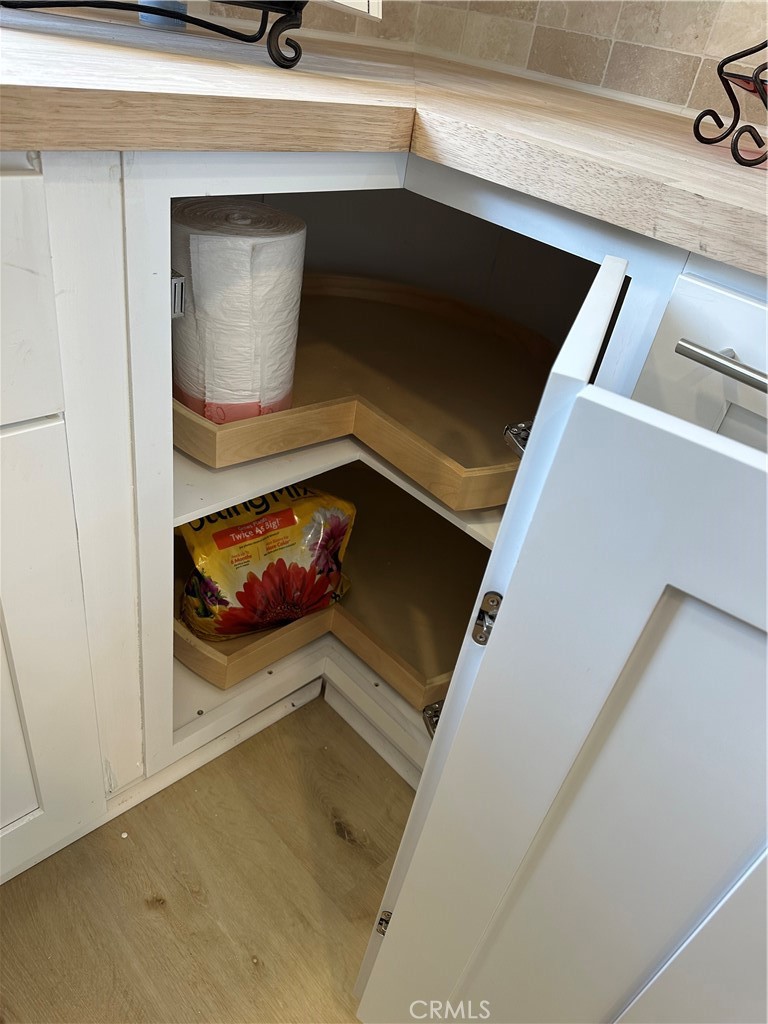 8514 East Baker Hill Road, Unit B Orange, CA 92869 - Photo 18 of 19 a view of an empty room and wooden floor