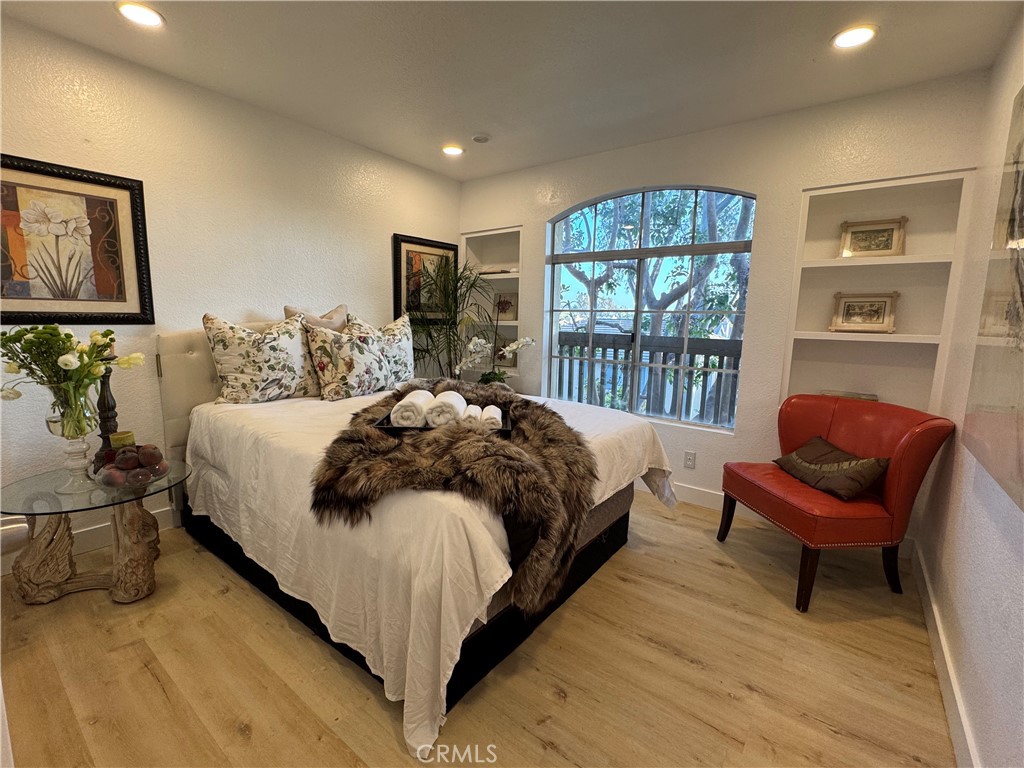 8514 East Baker Hill Road, Unit B Orange, CA 92869 - Photo 2 of 19 a bedroom with a bed and a couch