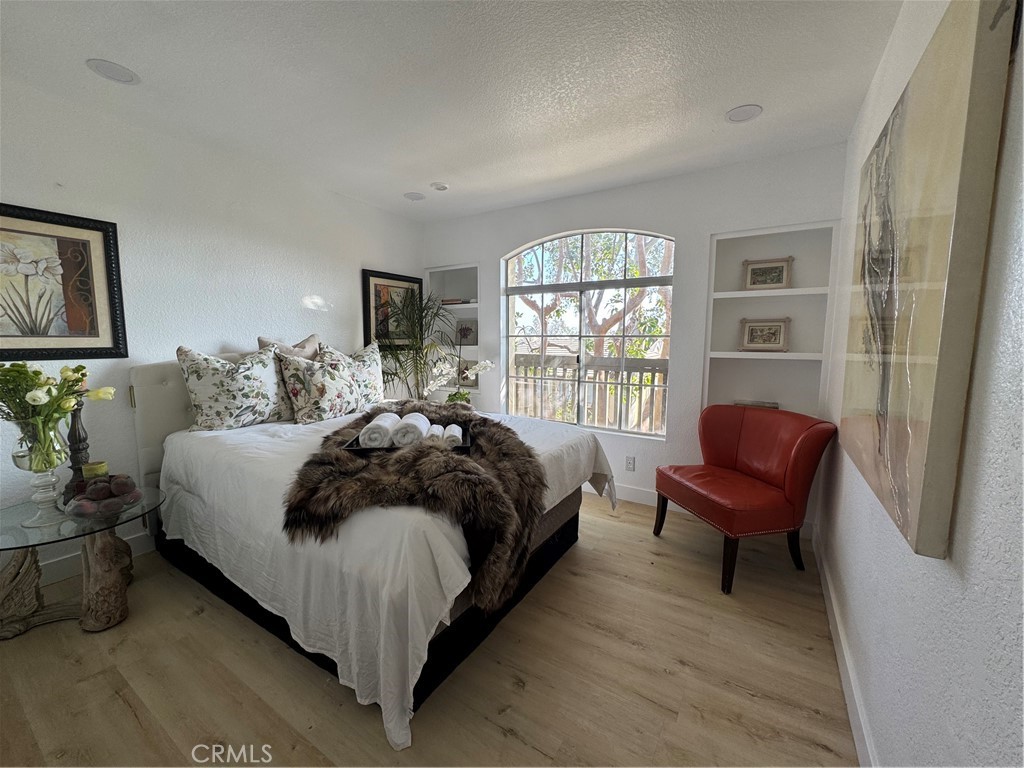 8514 East Baker Hill Road, Unit B Orange, CA 92869 - Photo 4 of 19 a bed room with a bed and a chair