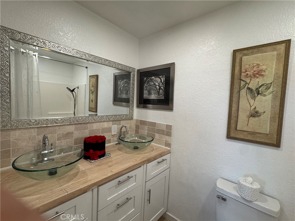 8514 East Baker Hill Road, Unit B Orange, CA 92869 - Photo 6 of 19 a bathroom with a sink and a mirror