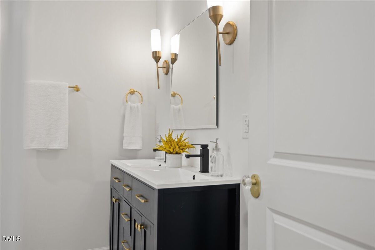 1615 Carbonton Road Sanford, NC 27330 - Photo 37 of 49 a bathroom with a sink and a mirror