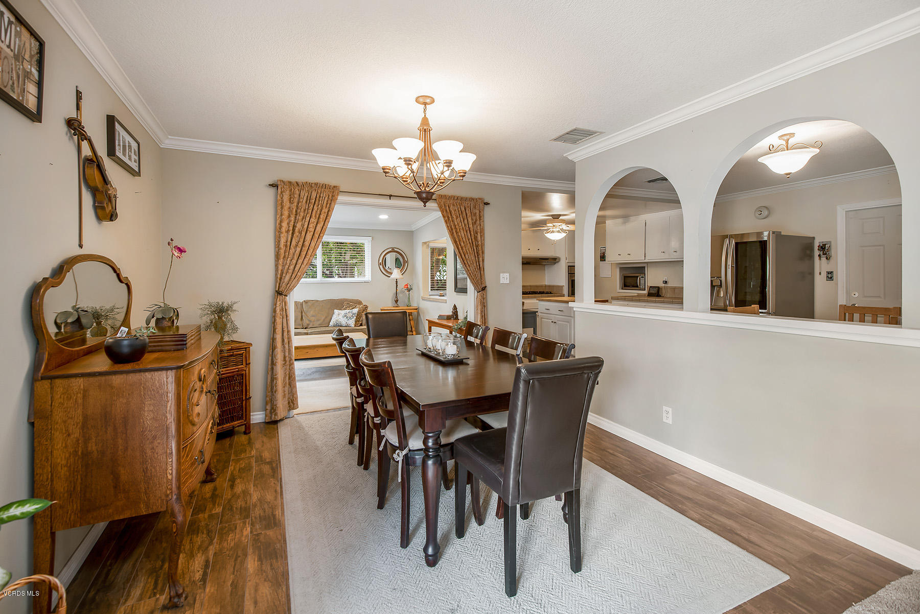 2974 Racine Street Simi Valley, CA 93065 - Photo 14 of 30 a view of a dining room with furniture and a chandelier