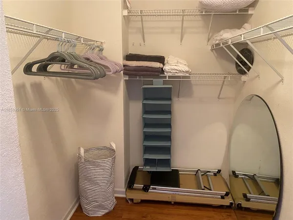 a view of a room with rack and gym equipment