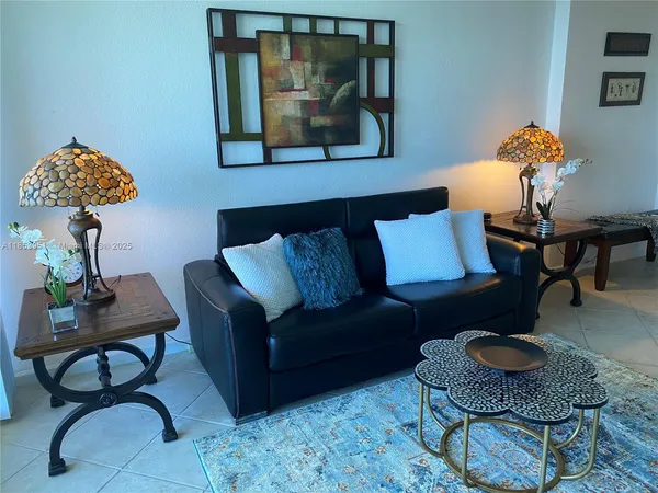 a living room with furniture and a rug