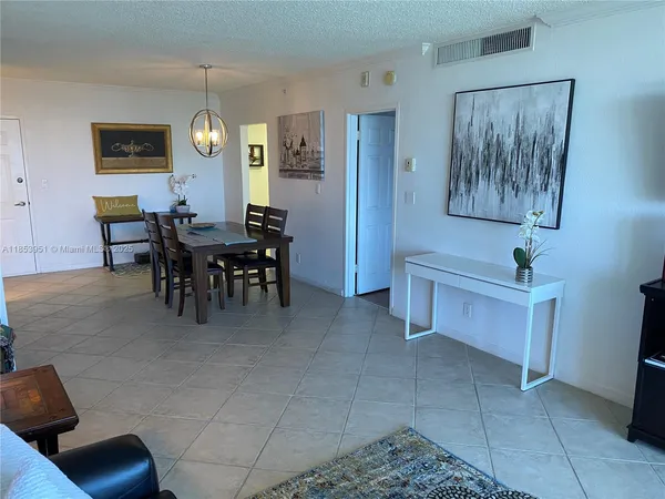 a view of a livingroom with furniture and window