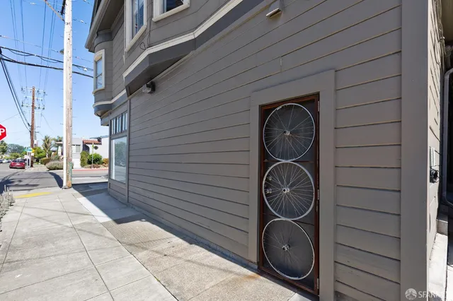 a backyard of a house with barbeque oven dryer and washer