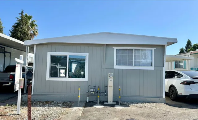 a front view of a house with parking