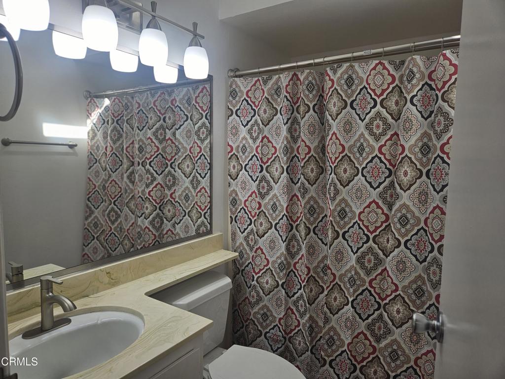 3510 Isle Way Oxnard, CA 93035 - Photo 13 of 26 a bathroom with a sink and a mirror