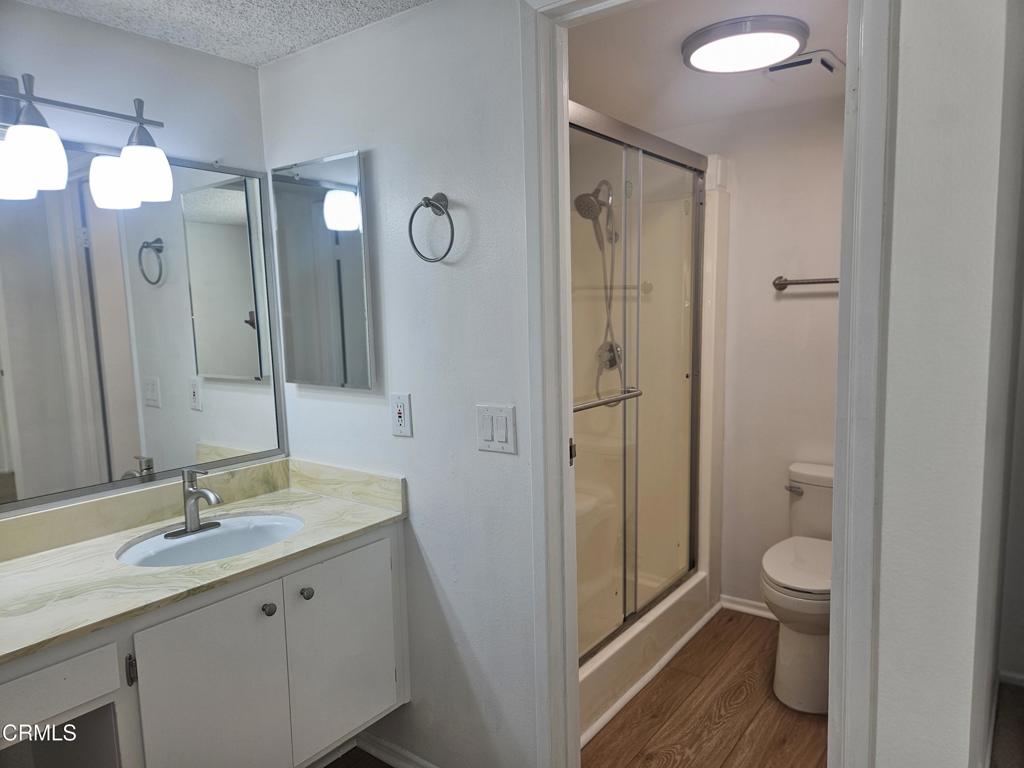 3510 Isle Way Oxnard, CA 93035 - Photo 16 of 26 a bathroom with a double vanity sink toilet and shower