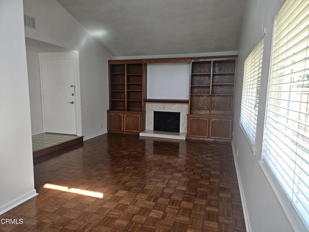 3510 Isle Way Oxnard, CA 93035 - Photo 5 of 26 wooden floor in an empty room with a fireplace