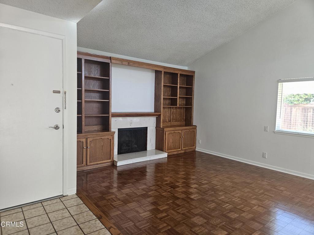 3510 Isle Way Oxnard, CA 93035 - Photo 6 of 26 wooden floor in an empty room with a fireplace
