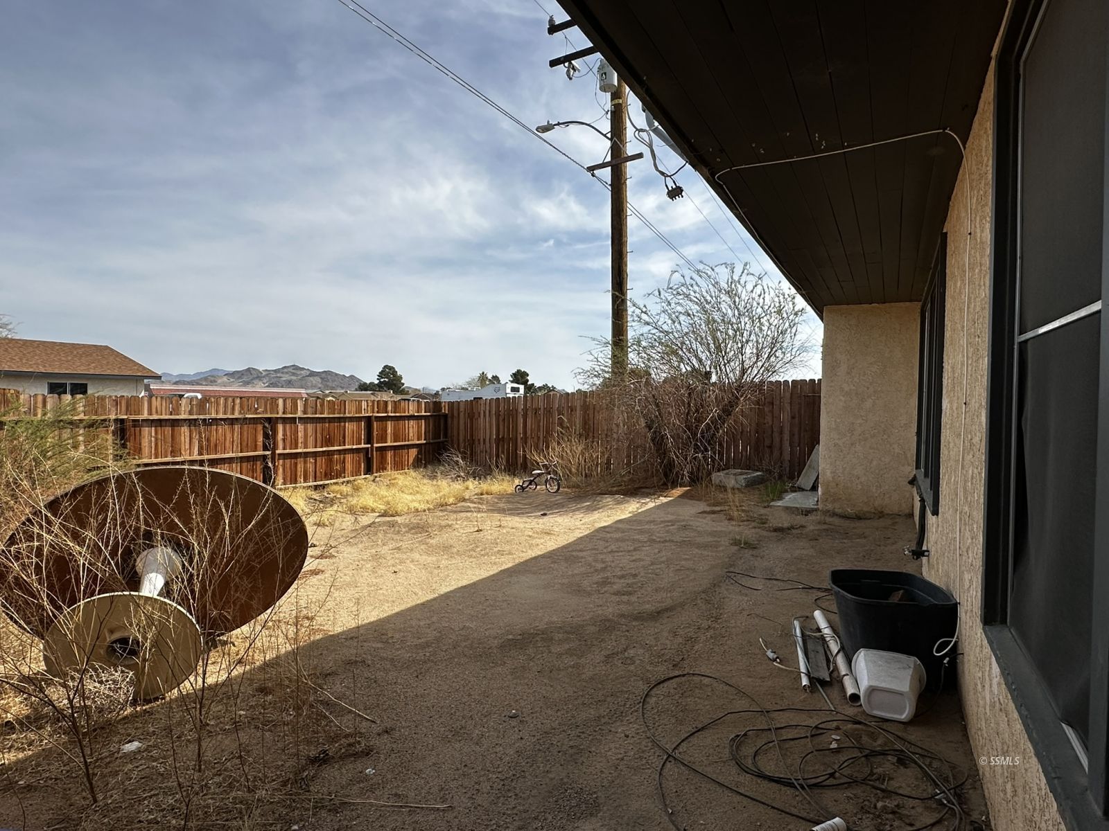 301 South Richmond Road Ridgecrest, CA 93555 - Photo 40 of 45 a view of roof deck with wooden fence