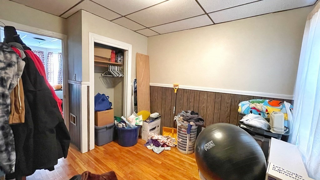 550 Eastern Avenue Lynn, MA 01902 - Photo 14 of 32 a bed room with a bed and a couch