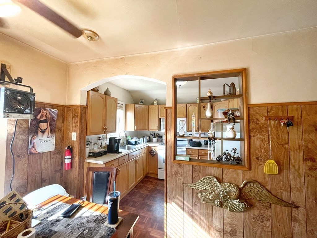 550 Eastern Avenue Lynn, MA 01902 - Photo 21 of 32 a living room with furniture and a floor to ceiling window