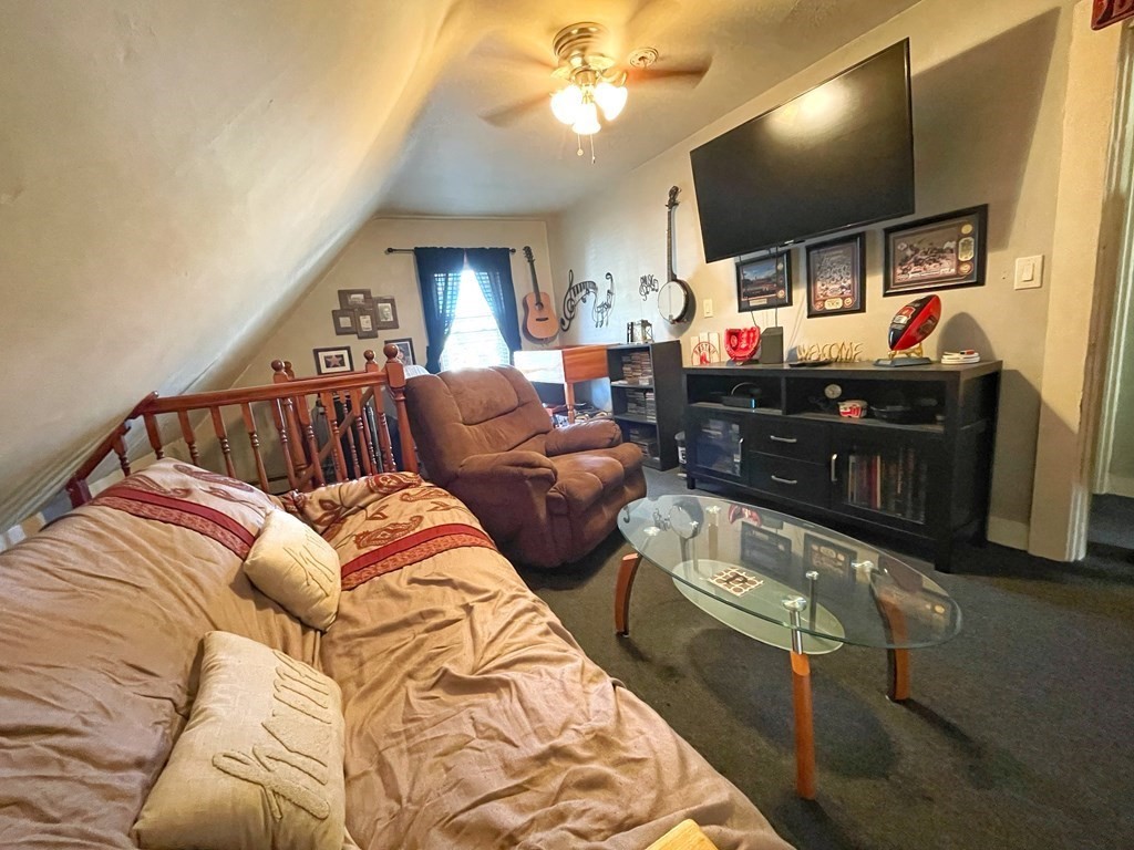 550 Eastern Avenue Lynn, MA 01902 - Photo 27 of 32 a living room with furniture and a flat screen tv