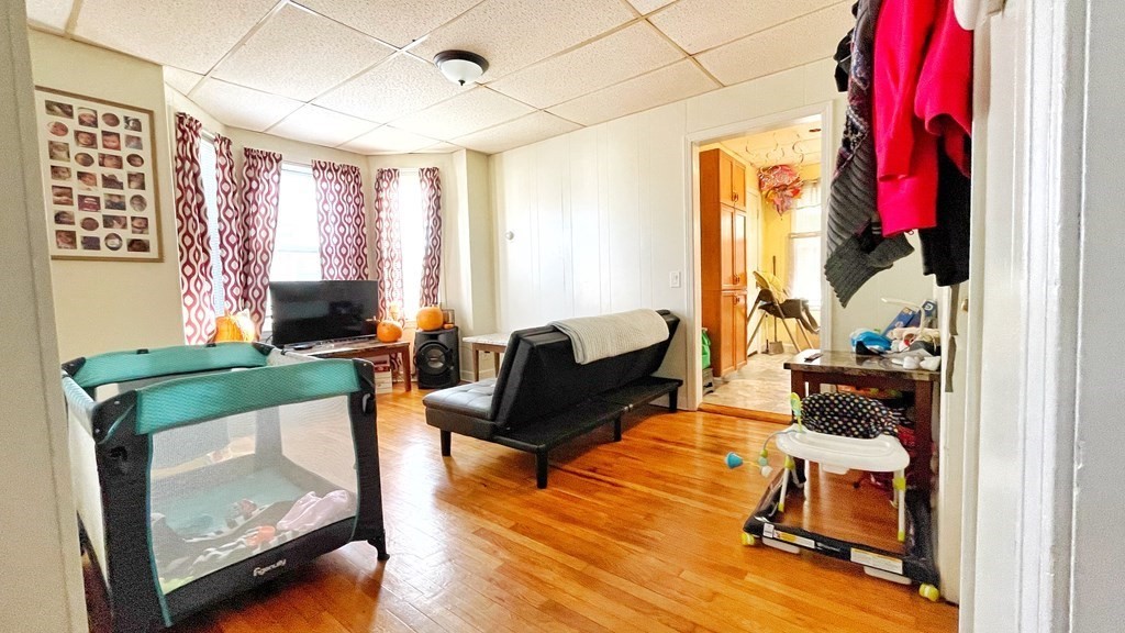 550 Eastern Avenue Lynn, MA 01902 - Photo 8 of 32 a living room with furniture and a fireplace