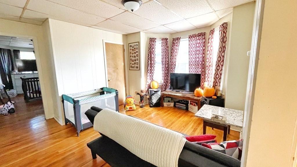 550 Eastern Avenue Lynn, MA 01902 - Photo 9 of 32 a living room with furniture and a flat screen tv