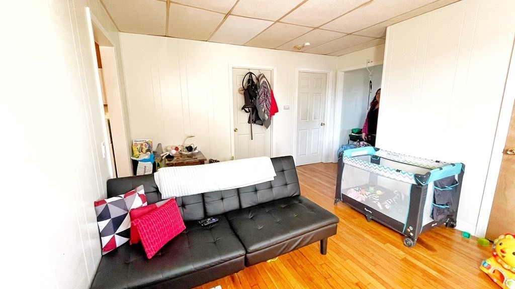 550 Eastern Avenue Lynn, MA 01902 - Photo 10 of 32 a living room with furniture and a mirror