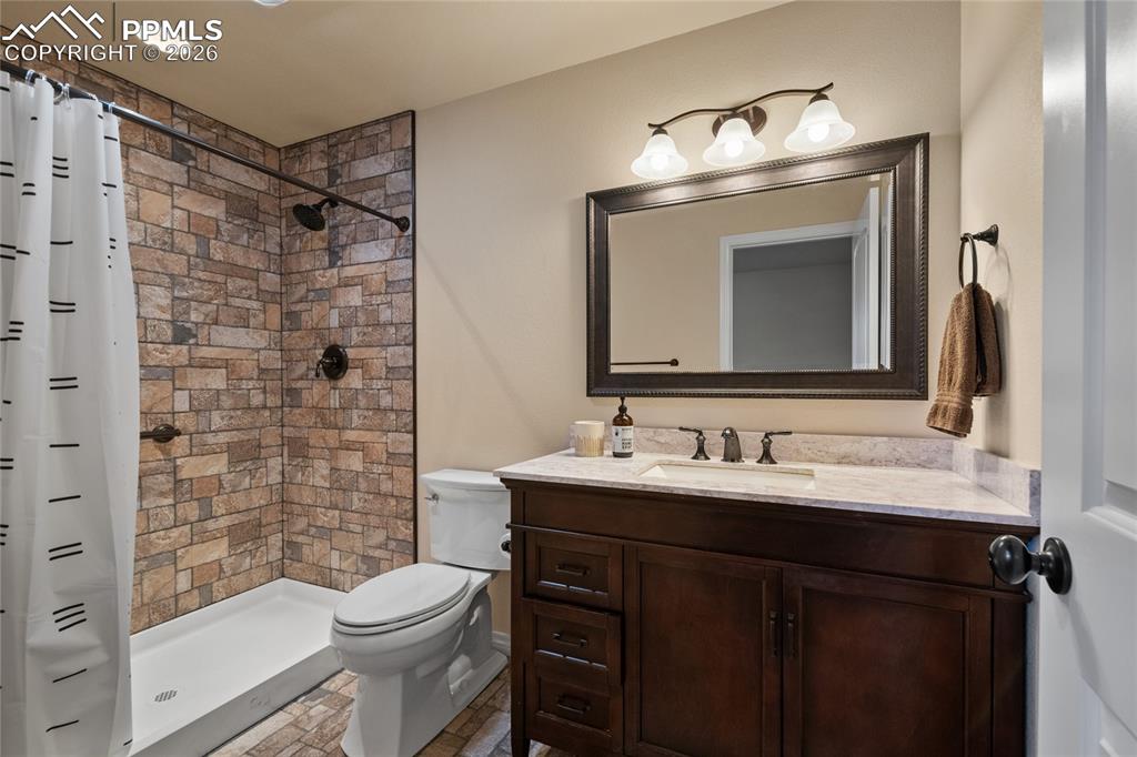 3718 Sky Rim Court Colorado Springs, CO 80908 - Photo 42 of 49 Lower level 3/4 ensuite bath inside bedroom #6.